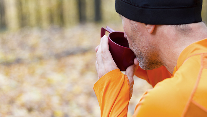 Image Of An Athletic Man Outdoors Drinking Coffee Caffeine And Athletic Performance