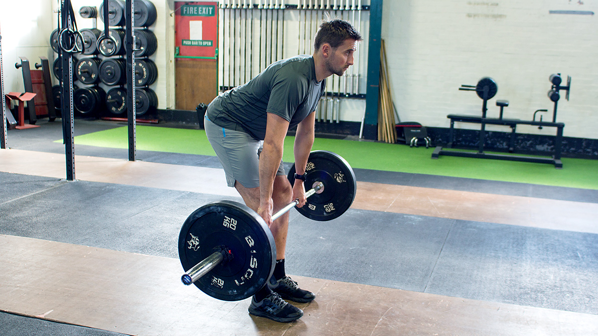 Image Of A Runner Deadlifting To Experience Deadlift For Runner Benefits