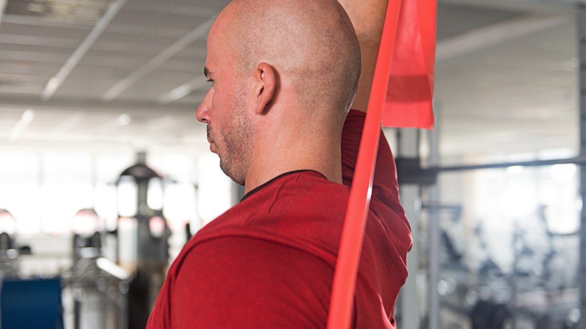 Man Warms Up With The Latex Resistance Band