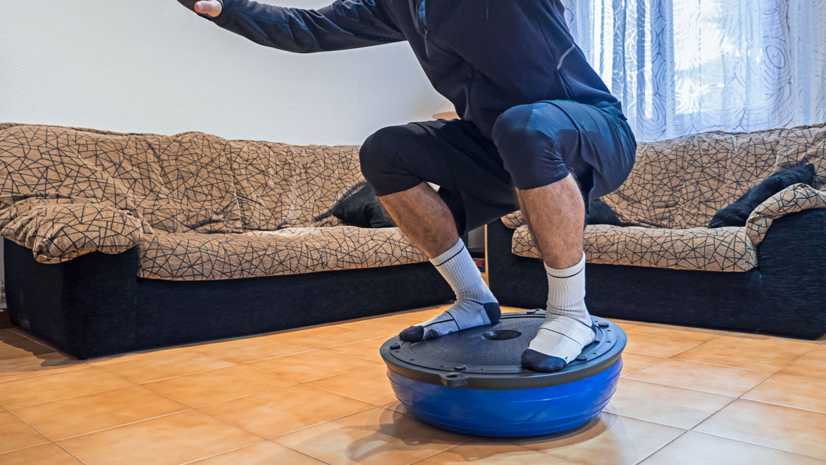 Athlete Doing Strength And Balance Exercises On A Bosu Ball At H