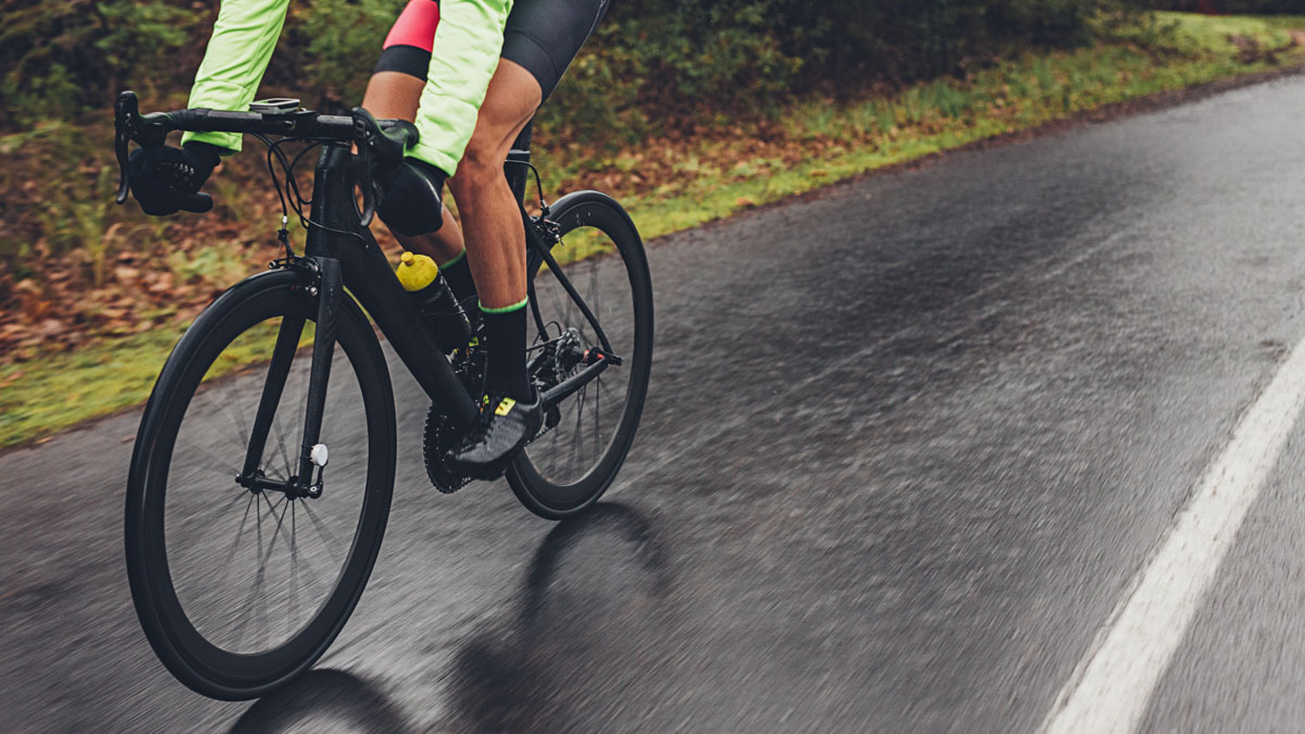 Cyclist Training Outdoors On A Rainy Day