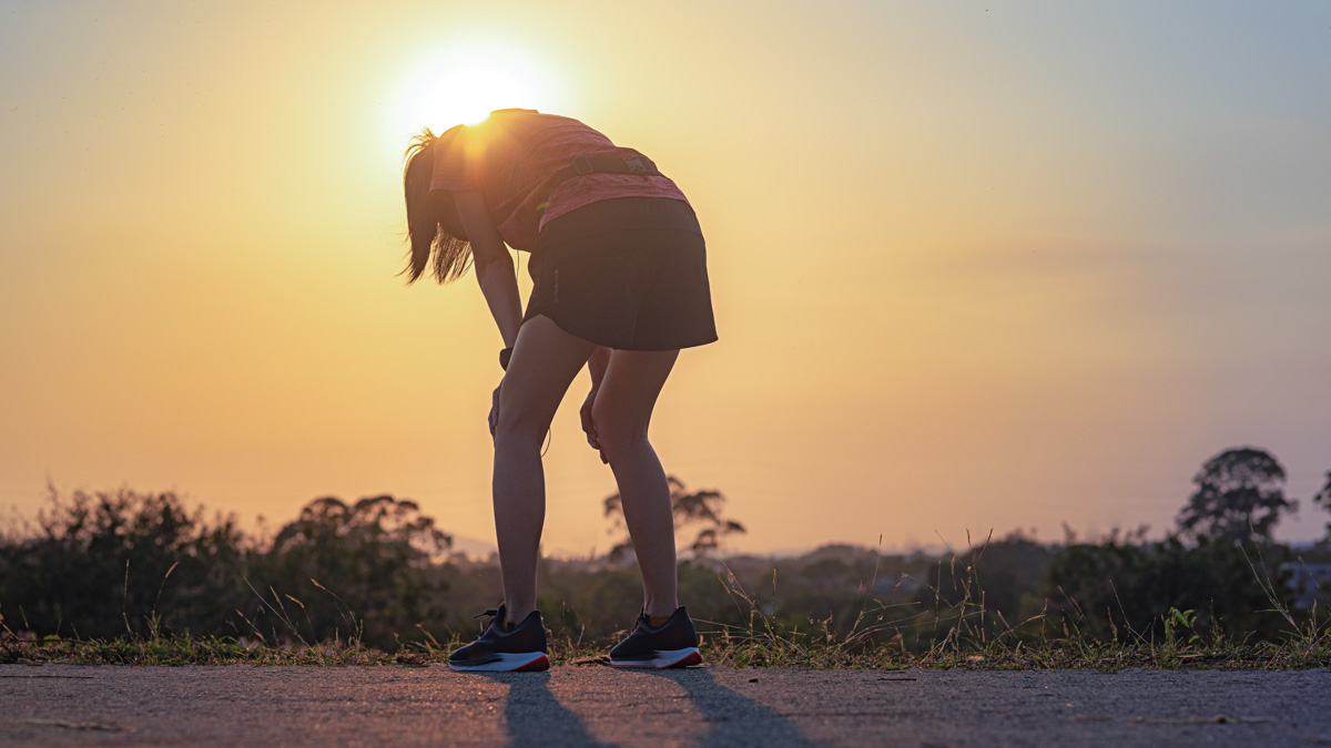 Tired Woman Runner Taking A Rest After Running Hard On Countrysi