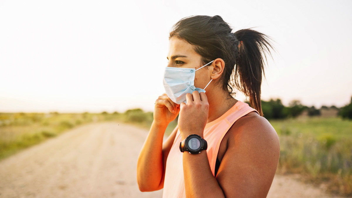 Athletic Woman With Face Mask Down The Field