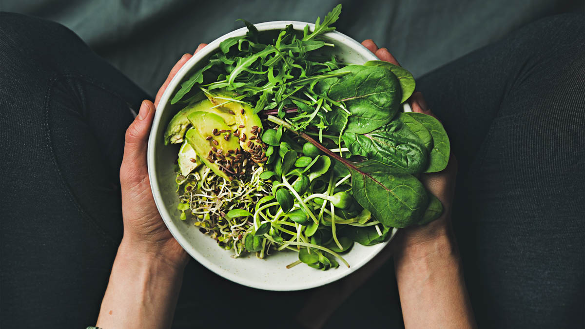 Plant Based Breakfast With Spinach, Arugula, Avocado, Seeds And Sprouts In Bowl