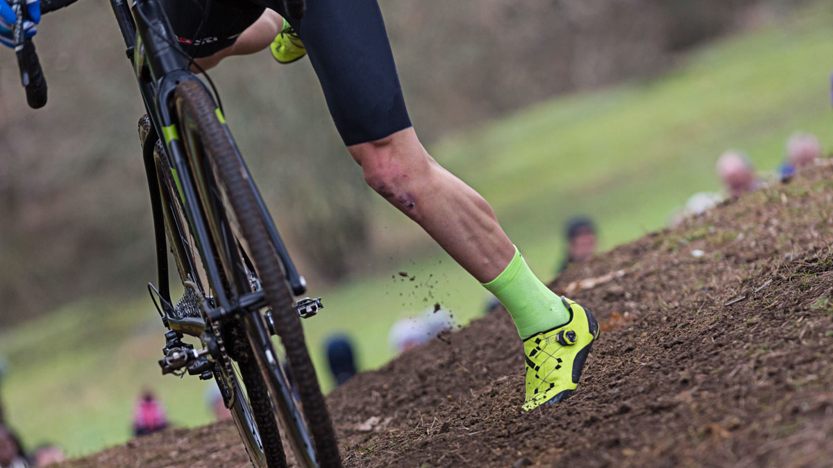 Male Cyclist Shot Of Legs In The Dirt During Cyclocross Racing