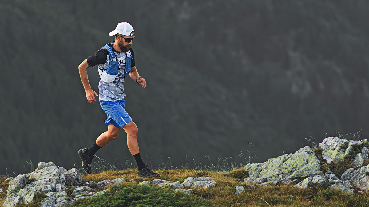 Image Of A Fit Young Male Runner On A Rocky Mountain Trail Competing In A High Altitude Marathon