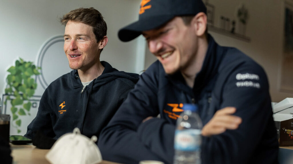 Human Powered Health Pro Cyclist Gavin Mannion with teammate indoors at spring training camp