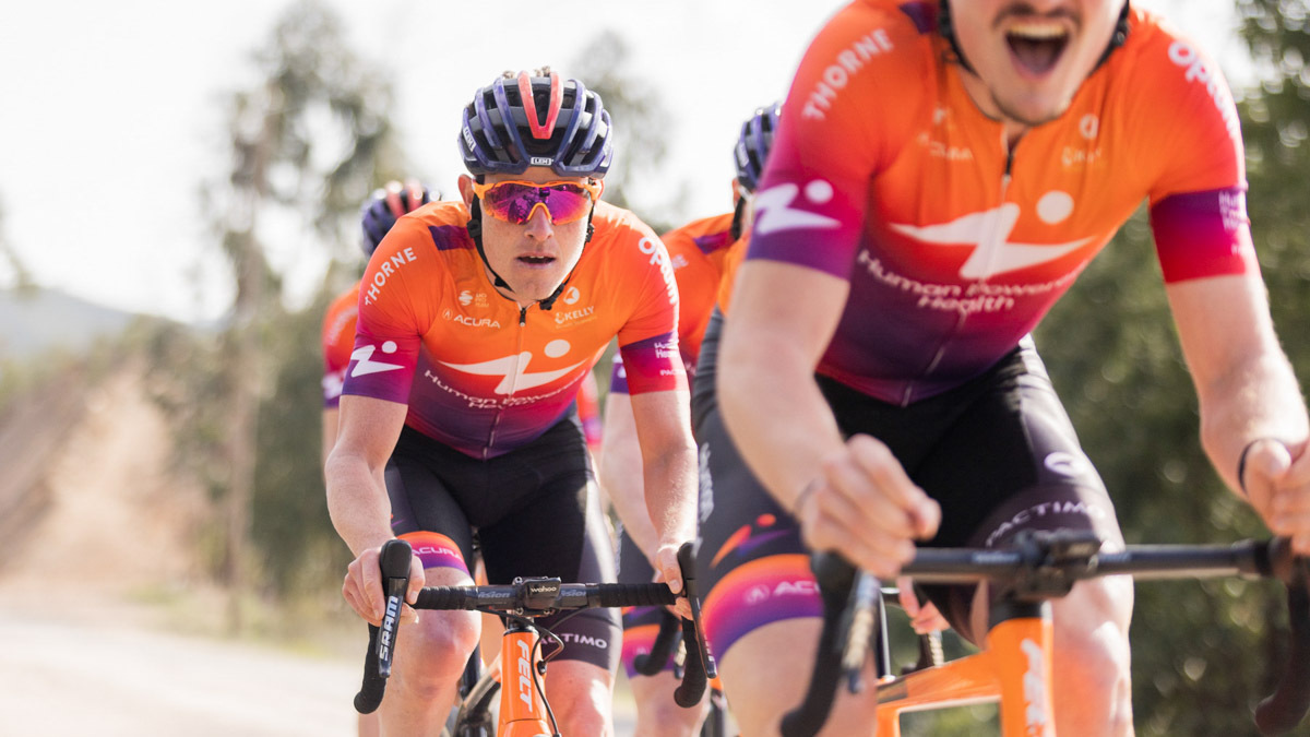 Human Powered Health Cyclist Gavin Mannion In Pro Jersey Rides In Mock Race At Spring Training Camp