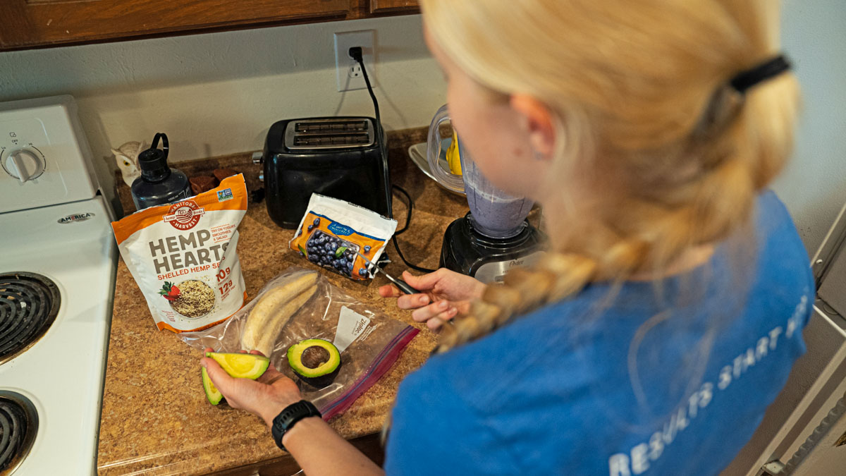 A Woman Athlete Making A Healthy Meal In Her Kitchen