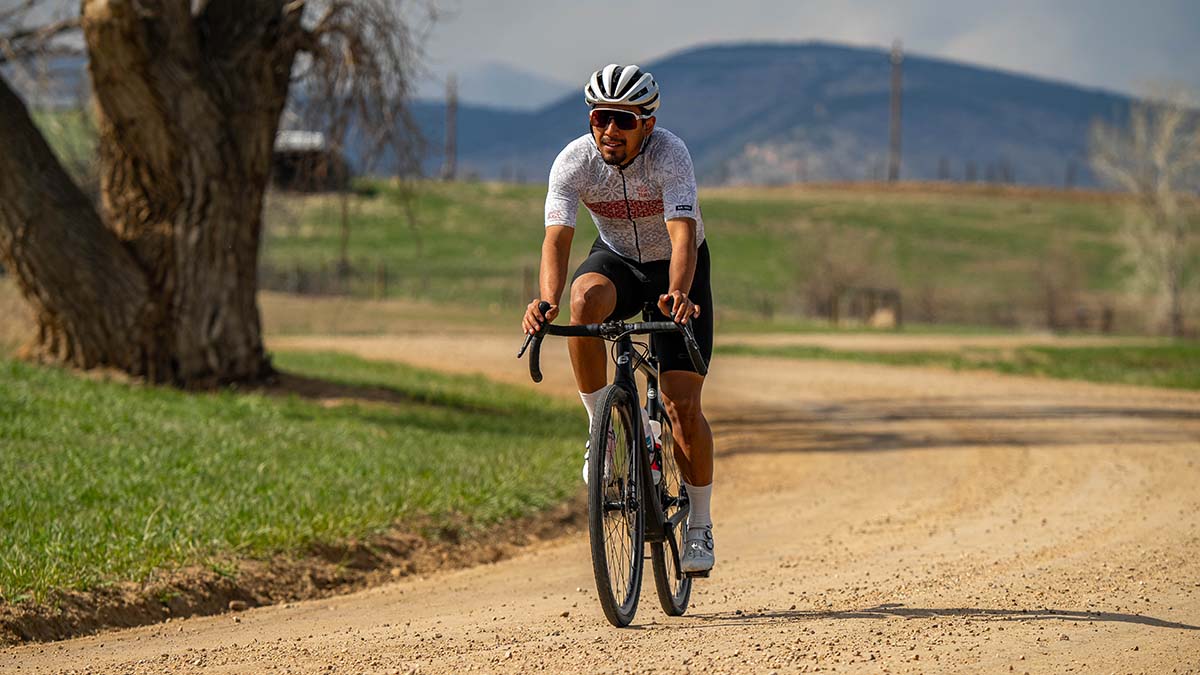 A Male Gravel Rider On A Country Dirt Road